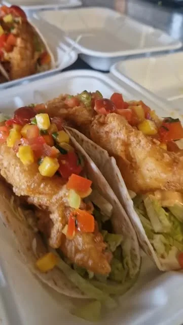 Crispy battered fish tacos with mango salsa