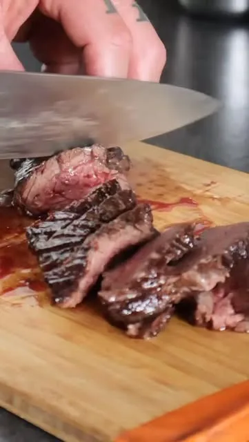Hanger steak being sliced